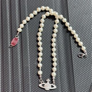 Pearl Necklace with Saturn Pendent